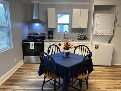 Kitchen with stainless steel range with electric c