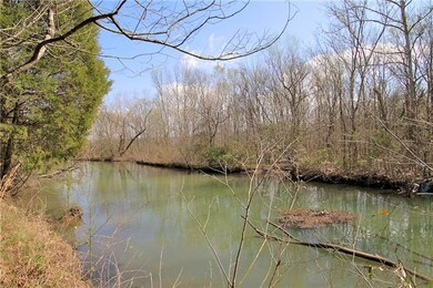 This home backs up to Corp property and offers a small view of the lake.  This view is what you would see if you walked to the edge of your property, just past the tree line.
