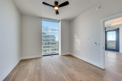 Empty room featuring ceiling fan, light wood-type 