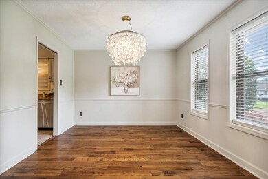 Spare room featuring a chandelier, ornamental mold