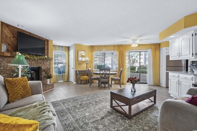 Living area featuring a fireplace, light wood-styl