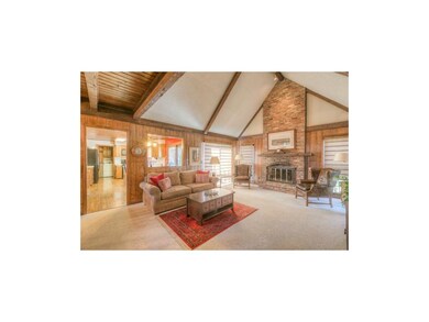 Large, dramatic family room with beamed, vaulted c