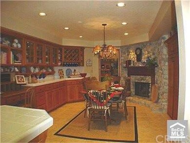 Expansive eating area and fireplace in kitchen