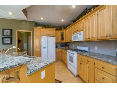 Beautiful Maple Cabinets and Granite Counter-tops.