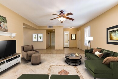 Living Room, Foyer, and Coat Closet with Plantation Shutters, shelve, ceiling fan, and tile floors!