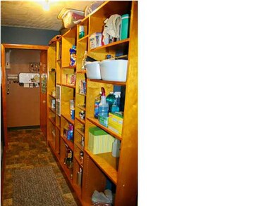 The large walk-in pantry adjacent to the kitchen h