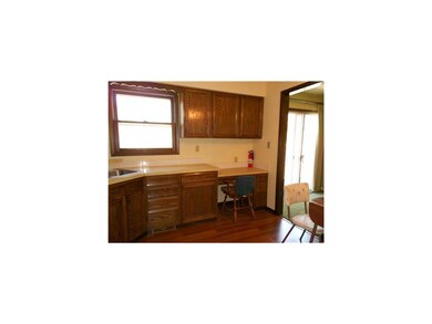 Kitchen. New flooring highlights this bright eat i