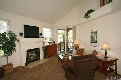 Spacious great room with high ceilings & fireplace
