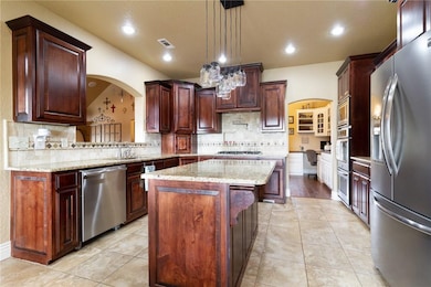 Kitchen is a chef's dream - granite counters, doub