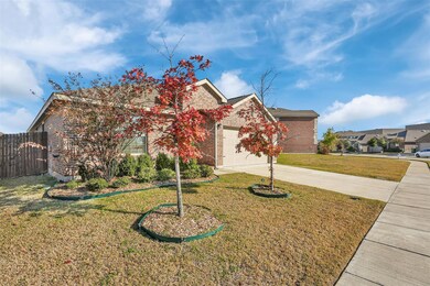 View of front facade with a garage and a front lawn