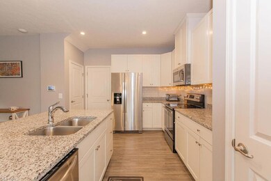 Kitchen with appliances with stainless steel finis