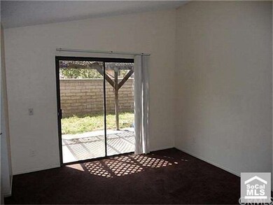 covered patio across the back yard. Master bedroom