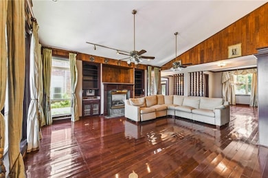 Huge den with gas fireplace and views of the lake.