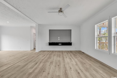 Unfurnished living room with wood finished floors,