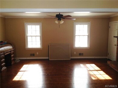 Family room with beautiful Hardwood Floors and fir