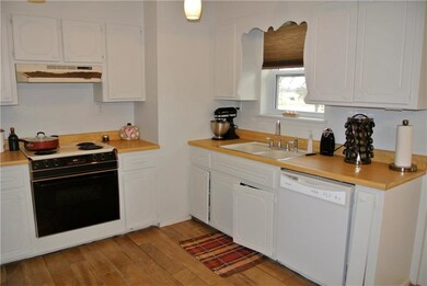 Kitchen with fresh paint and new tile floors.