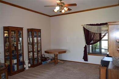 Formal living, ceiling fan, Crown mldg