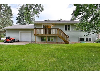 A nice back view of the home with a comfortable de