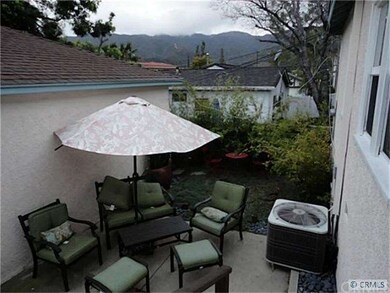 Patio between back of the house and the garage