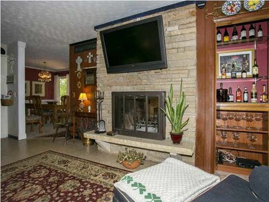 Main floor family room with woodburner, dry bar an
