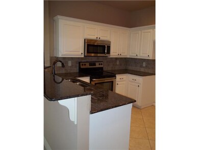 Kitchen. Gleaming Granite countertops, stainless a