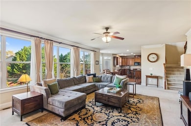 Large windows throughout the living room maximize natural light and offer great views.