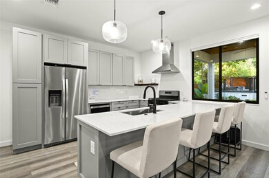 Kitchen featuring appliances with stainless steel