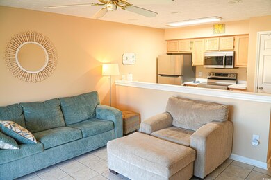 Living area with light tile patterned flooring, a 
