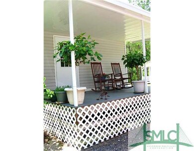 Other. A sweet sitting porch with entry through la
