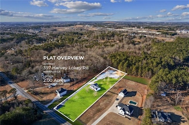 Aerial view of property and surrounding area with property boundaries highlighted and a forest