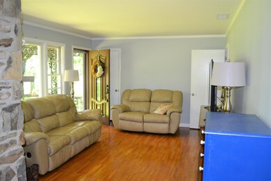 Additional view of living rm w/wooden front door