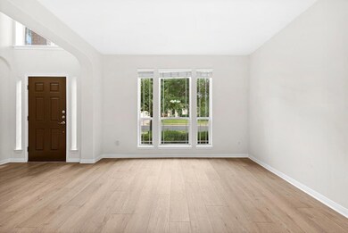 Foyer entrance with light wood-style flooring and