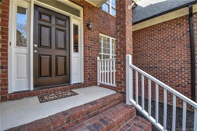 Welcoming entrance with a covered front porch and 