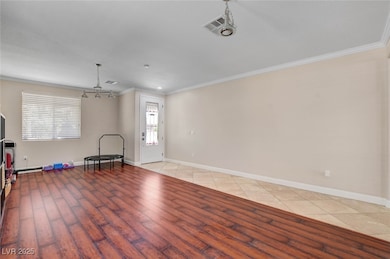 Unfurnished living room featuring ornamental moldi