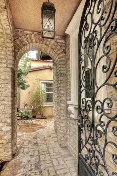 A wrought Iron gate welcomes the discerning Buyer