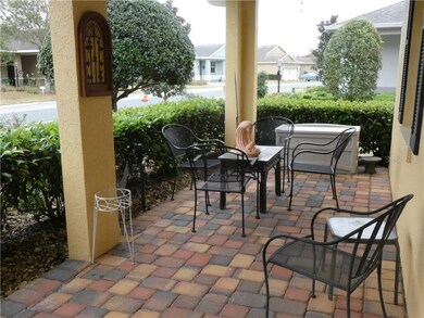 Enjoy front porch with brick pavers and chat with 
