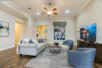 Spacious living area with wood like tile floors