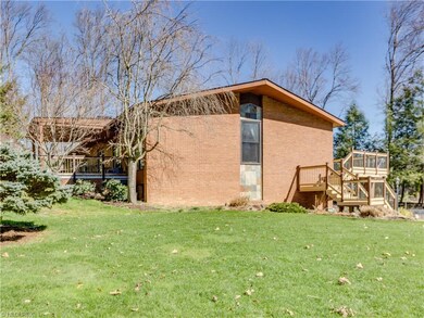 Front view, deck on the right, patio on the left.