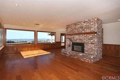 Another view of living room with fireplace. French