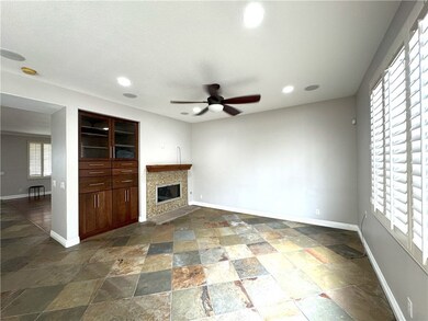 Separate Family Room with Custom Fireplace and built-in entertainment center.