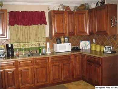 spacious kitchen with lots of cabinets and counter