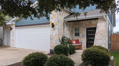 View of front of property featuring stone siding,