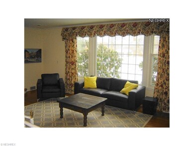 Dramatic bay window floods the space with natural 