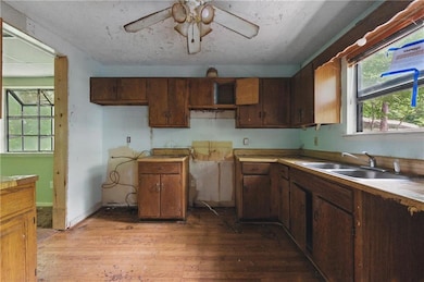 Kitchen featuring hardwood / wood-style floors and a ceiling fan