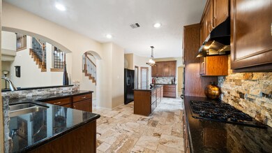 This oversized kitchen is a cook/chefs dream! Gas stove, custom stone backsplash!