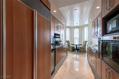 Kitchen featuring modern cabinets, appliances with