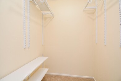 Spacious walk-in closet with customizable shelving