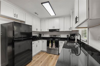 Updated granite and cabinets in this cozy kitchen