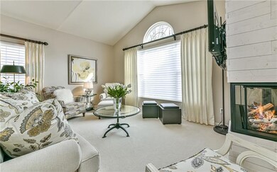 *VAULTED CEILING, SUNBURST WINDOW & NEUTRAL DECOR*