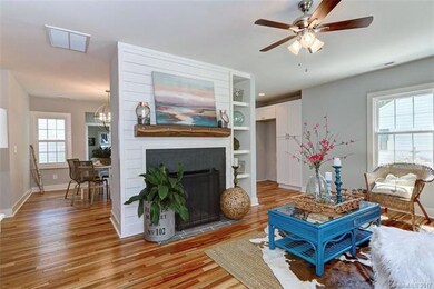 Fireplace trimmed in shiplap is the focal point of